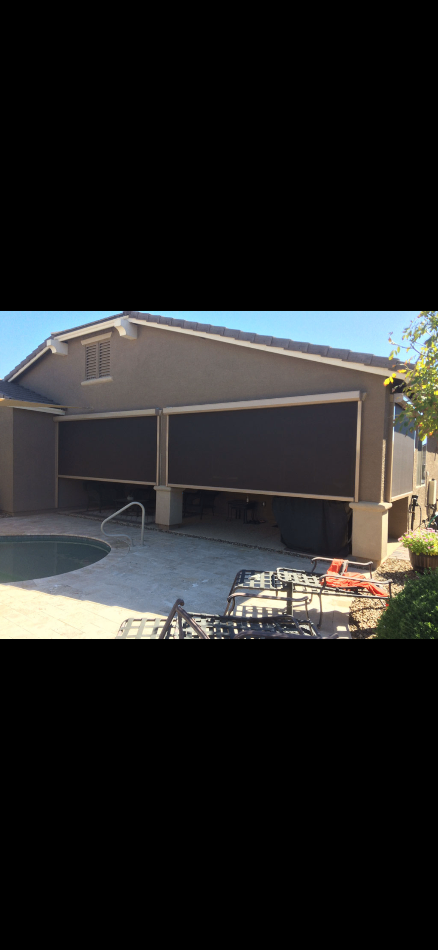 Poolside drop shade system completed by Valley Screens
